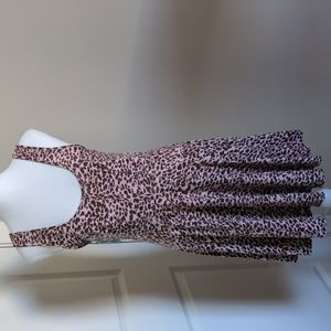 Free People size MEDIUM leopard print on pale pink is pleated nicely.  EUC